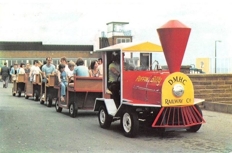 Old postcard of Derbyshire Miners Holiday Camp, Skegness showing the road train